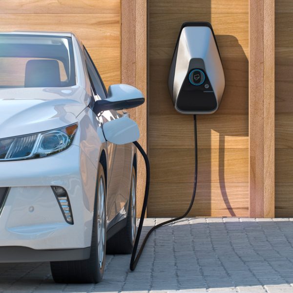 electric vehicle of the future using smart electric car charging station at home frontal perspective